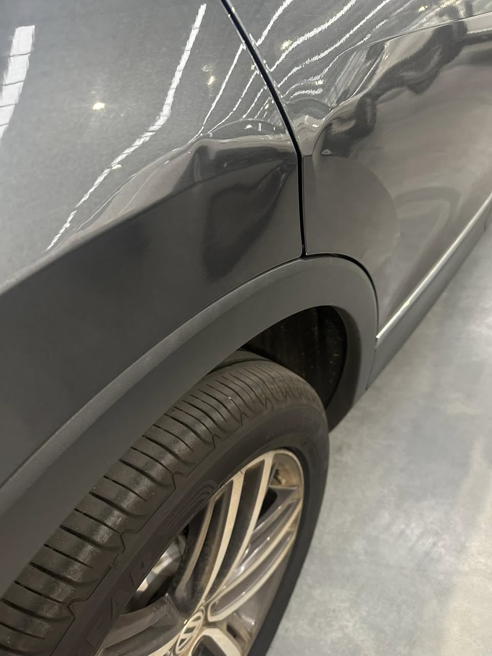 Large dent on car quarter panel before paintless dent removal